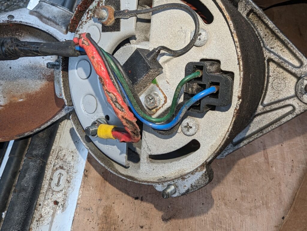Short-circuited alternator wiring before repair